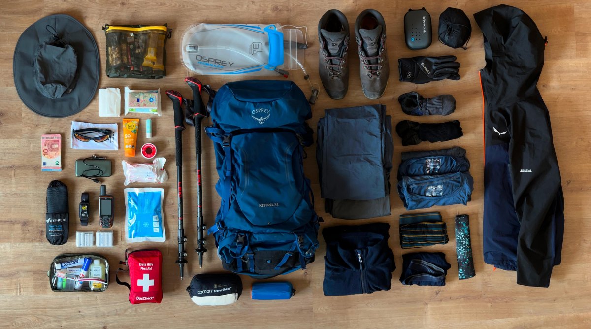 Hiking backpack gear checklist flat lay