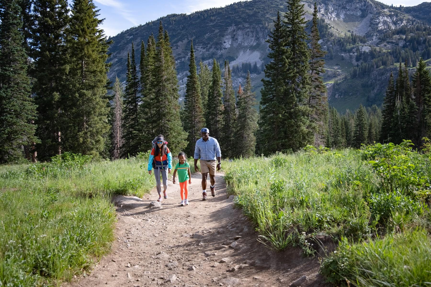 Family on gentle mountain trail