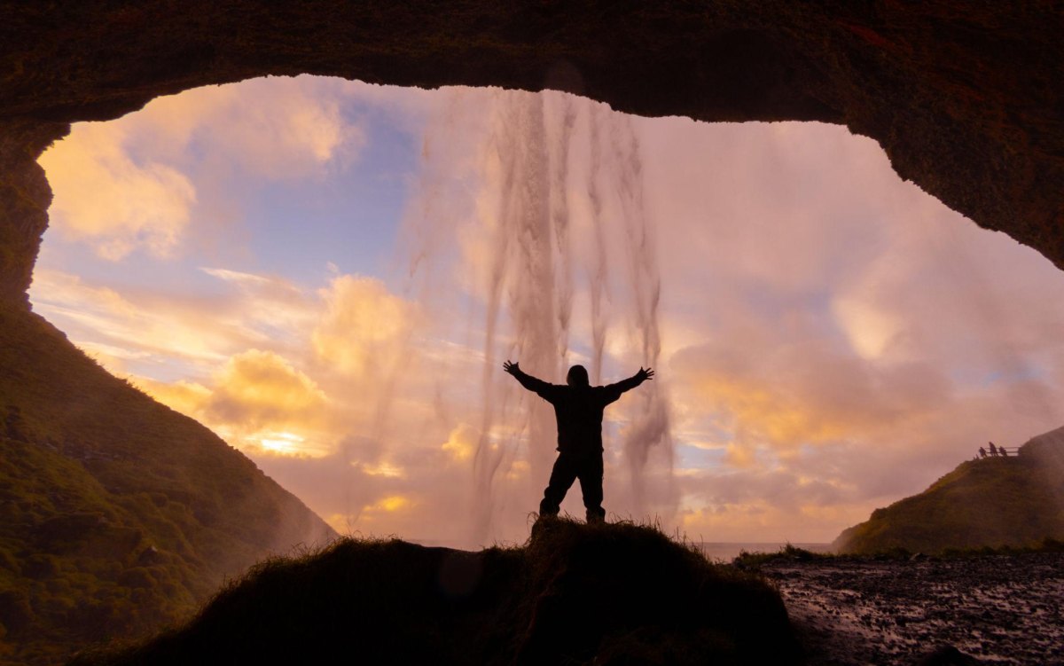 Silhouette hiker waterfall