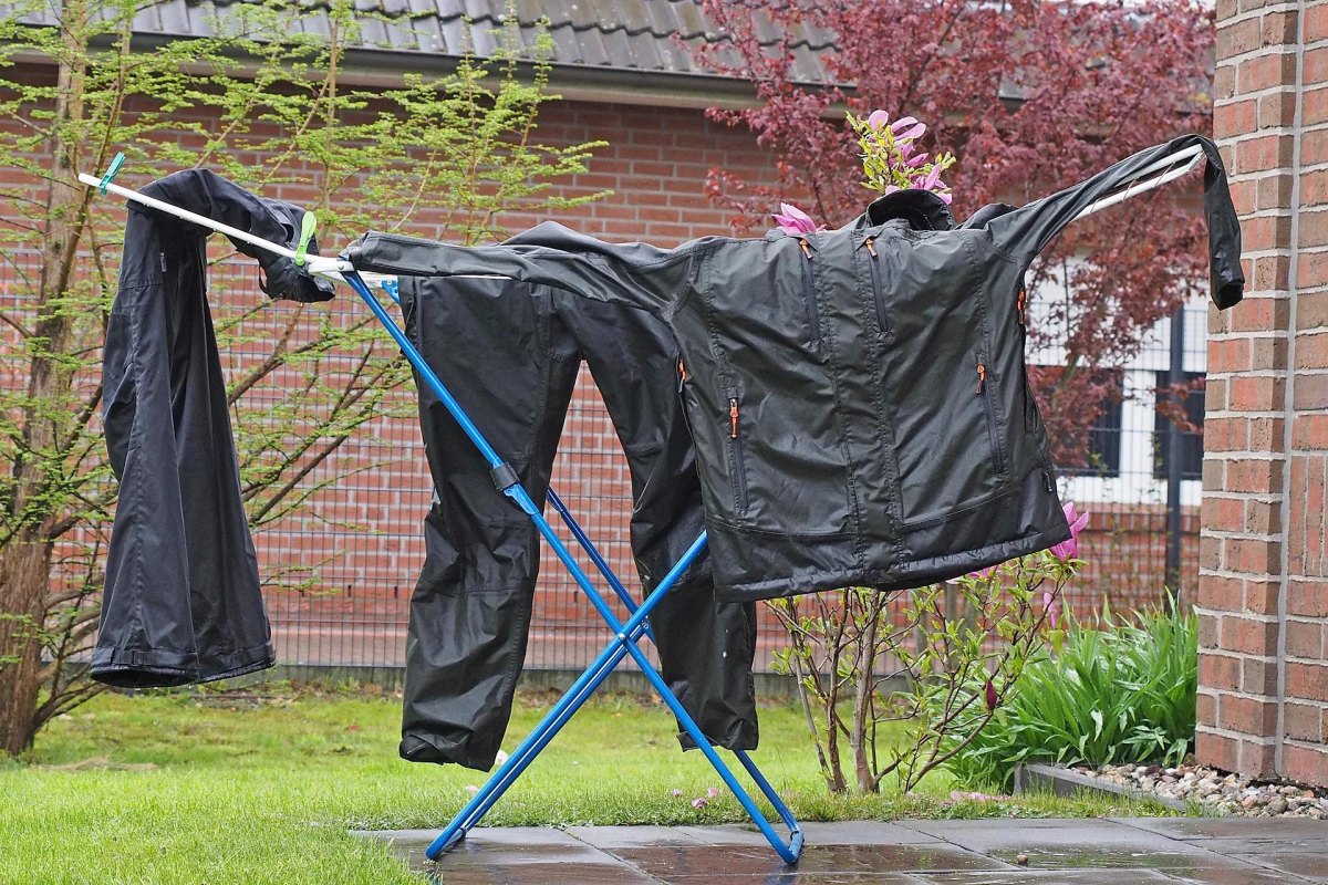 Wet hiking gear drying on rack