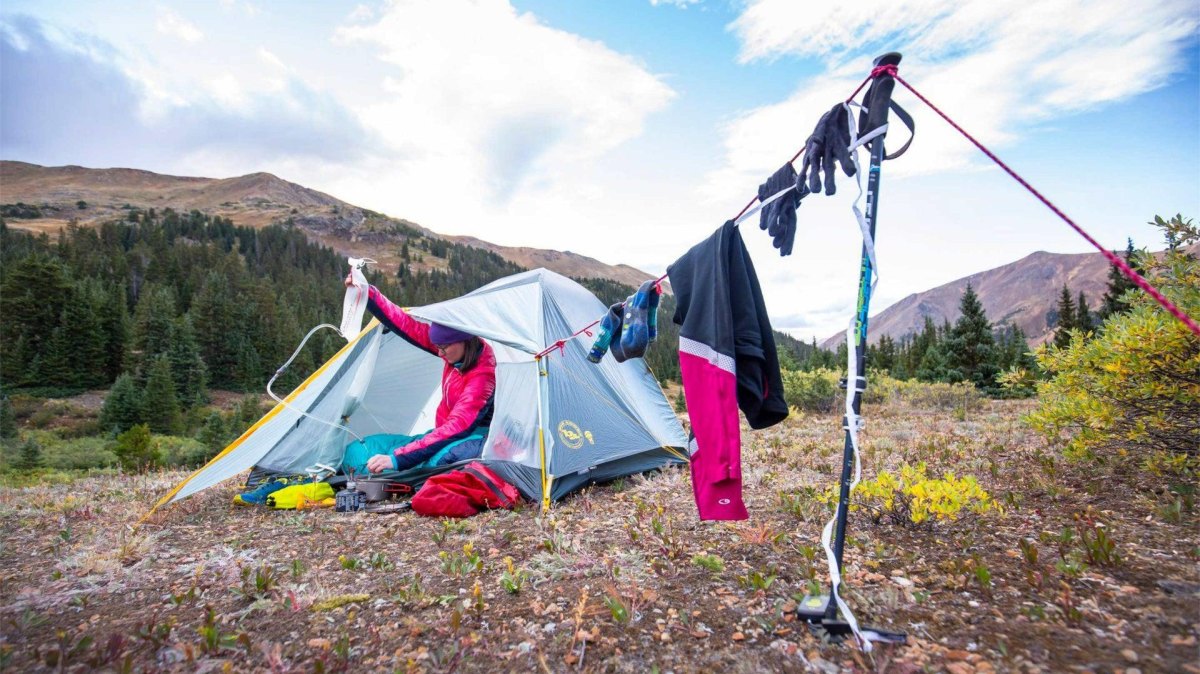 Backpack packing zones with organized hiking equipment