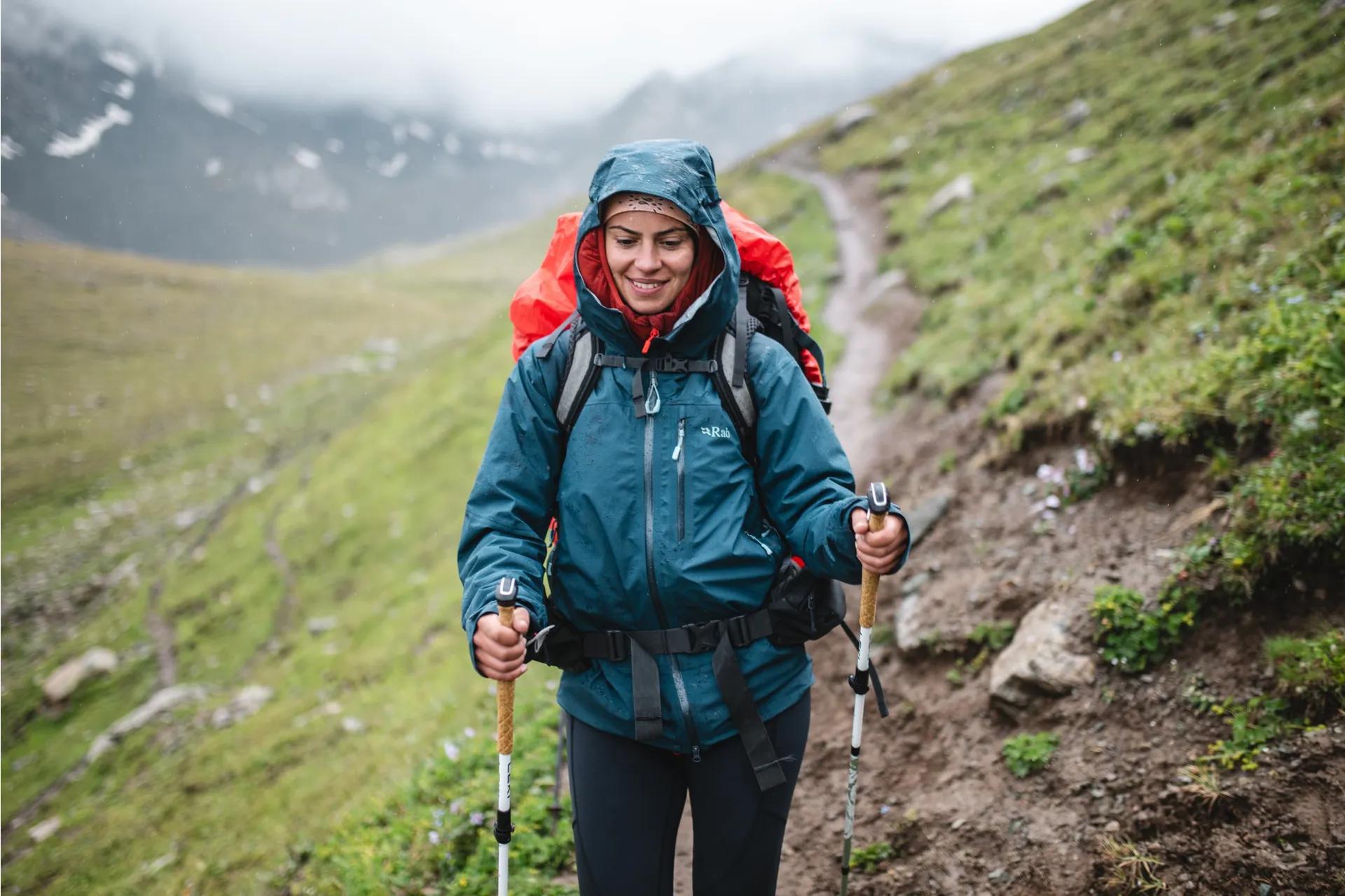 Hiker wearing outdoor clothing layers