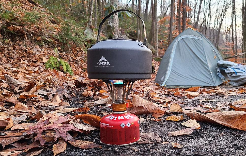 Backpacking stove at autumn campsite