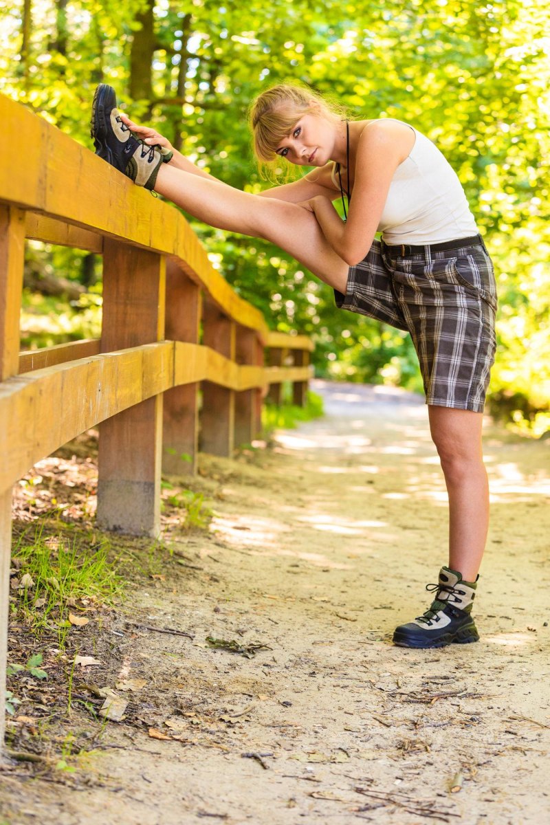 Woman stretching before hiking outdoors