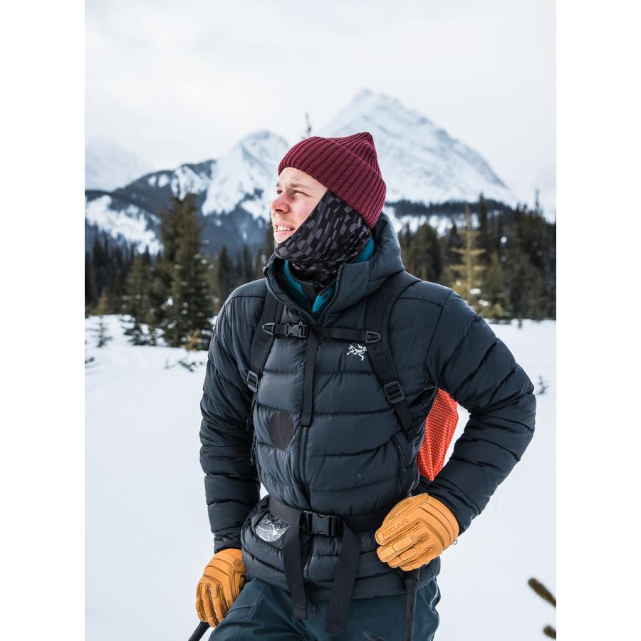 Hiker wearing hat gloves and neck gaiter