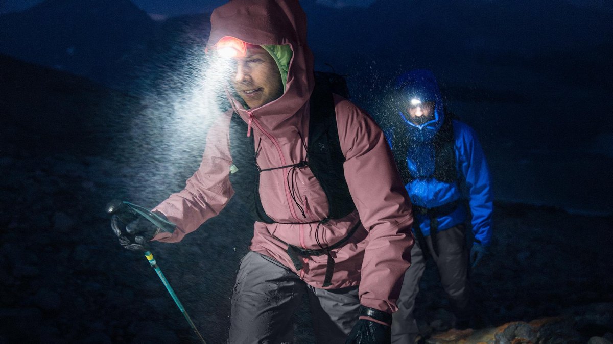 Hiker using headlamp in rain