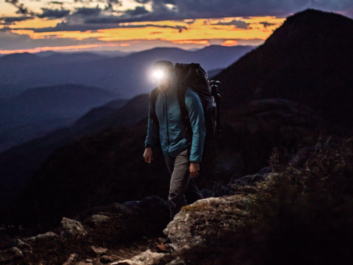 Hiker using headlamp at dusk