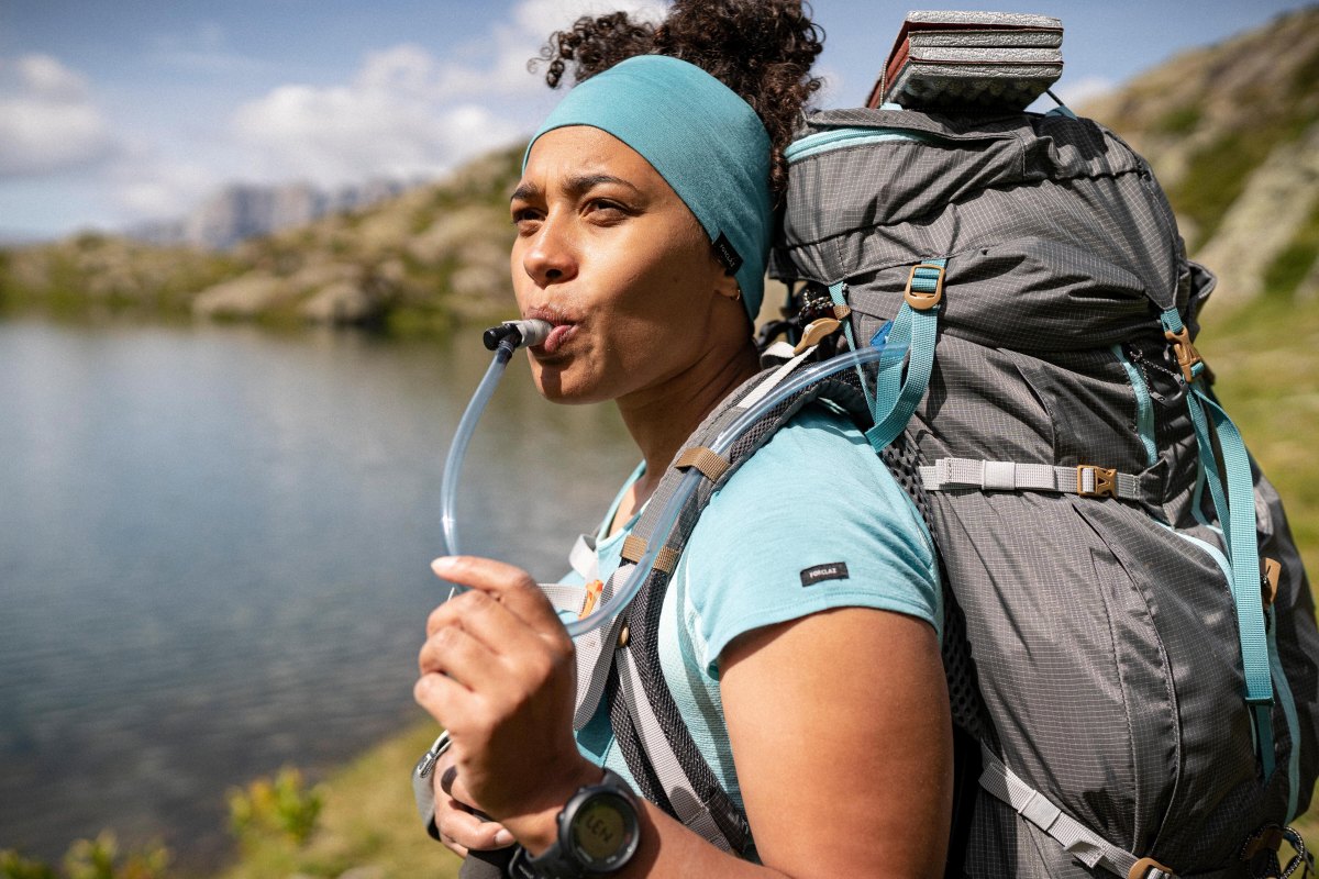Hiker drinking water outdoors