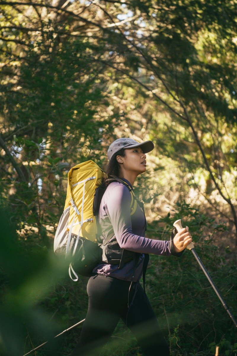 Woman carrying lightweight hiking backpack