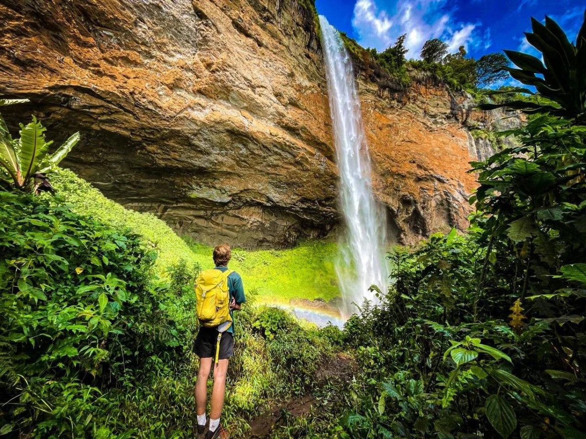 Hiker looking at waterfall