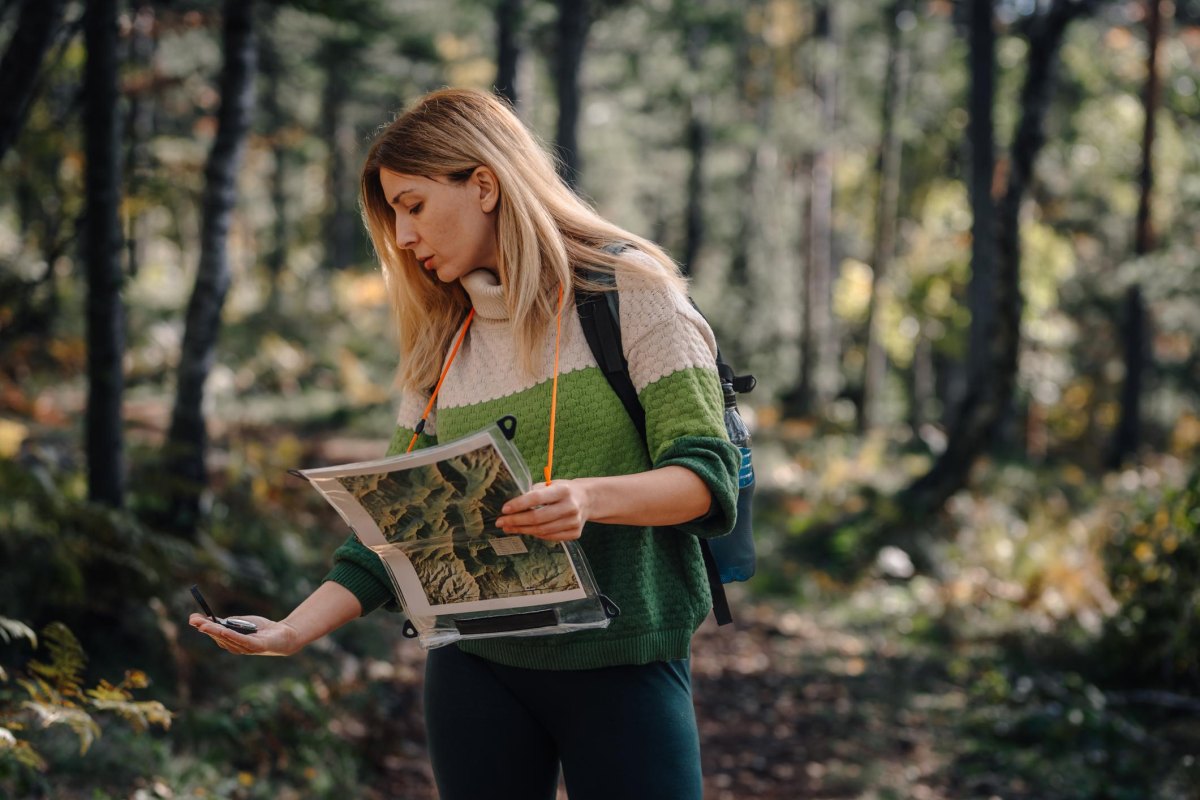 Map and compass on forest hike