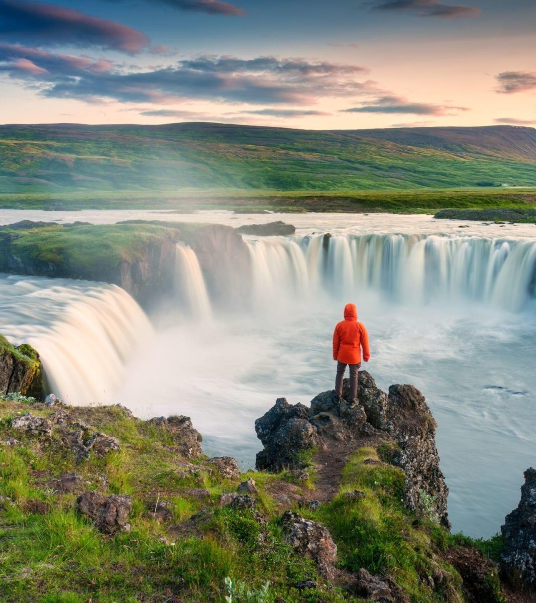 Hiker wide waterfall view