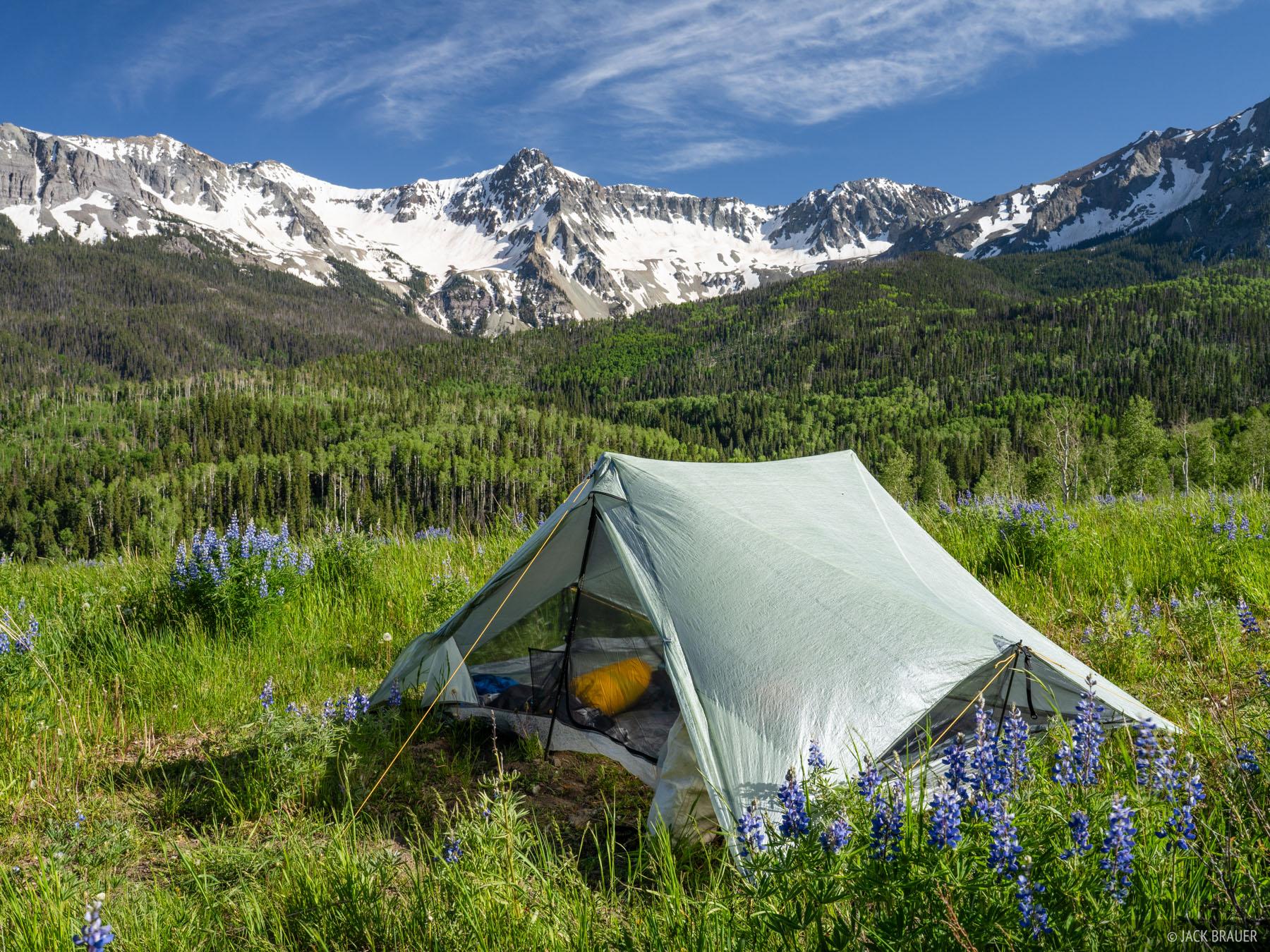 Lightweight tent beside mountain campsite