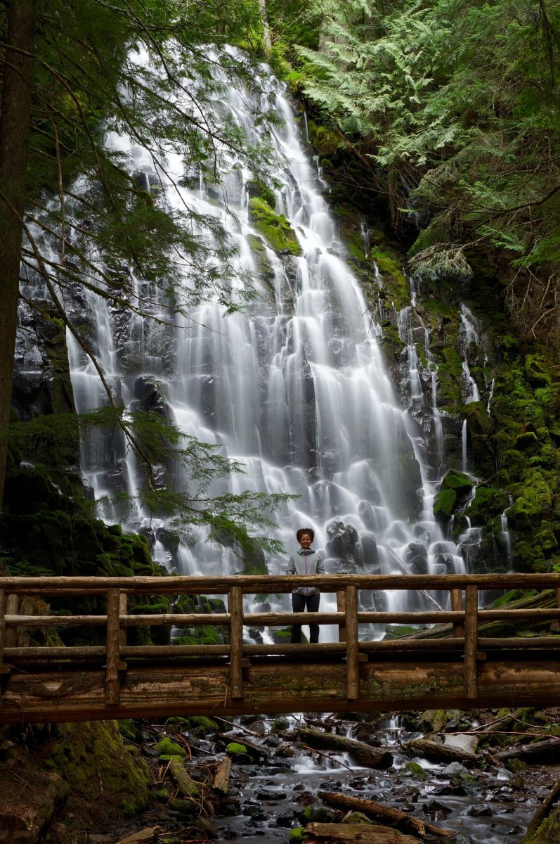 Hiker wooden bridge waterfall