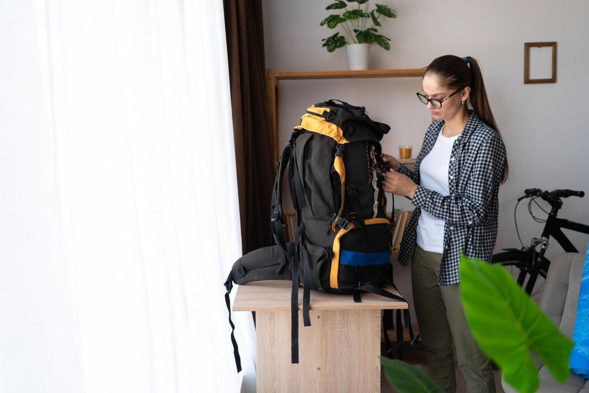 Backpacker testing loaded pack