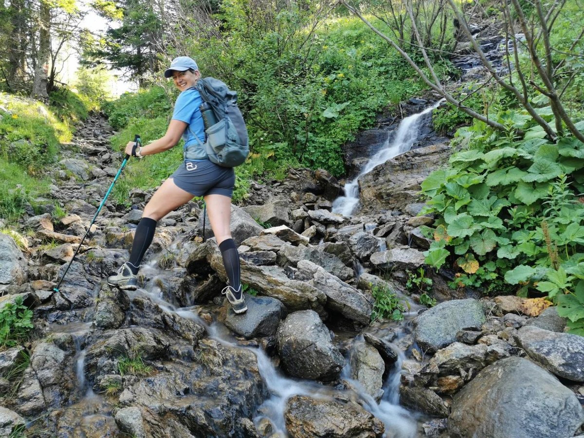 Trekking poles on rocky trail
