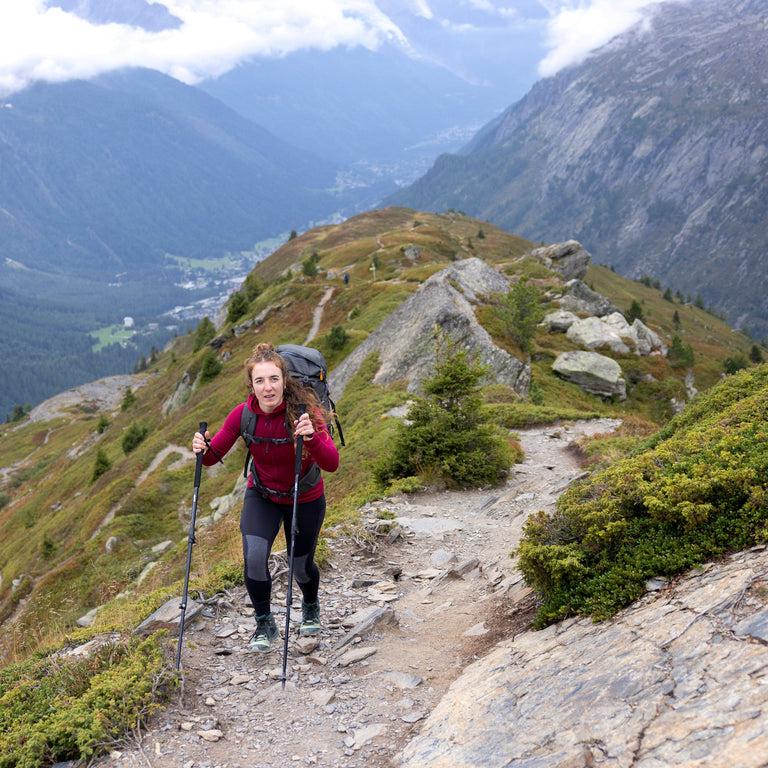Woman hiking with trekking poles