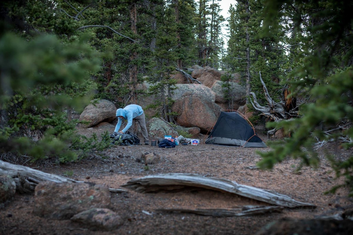 Waterproof backpack cover protecting gear from rain