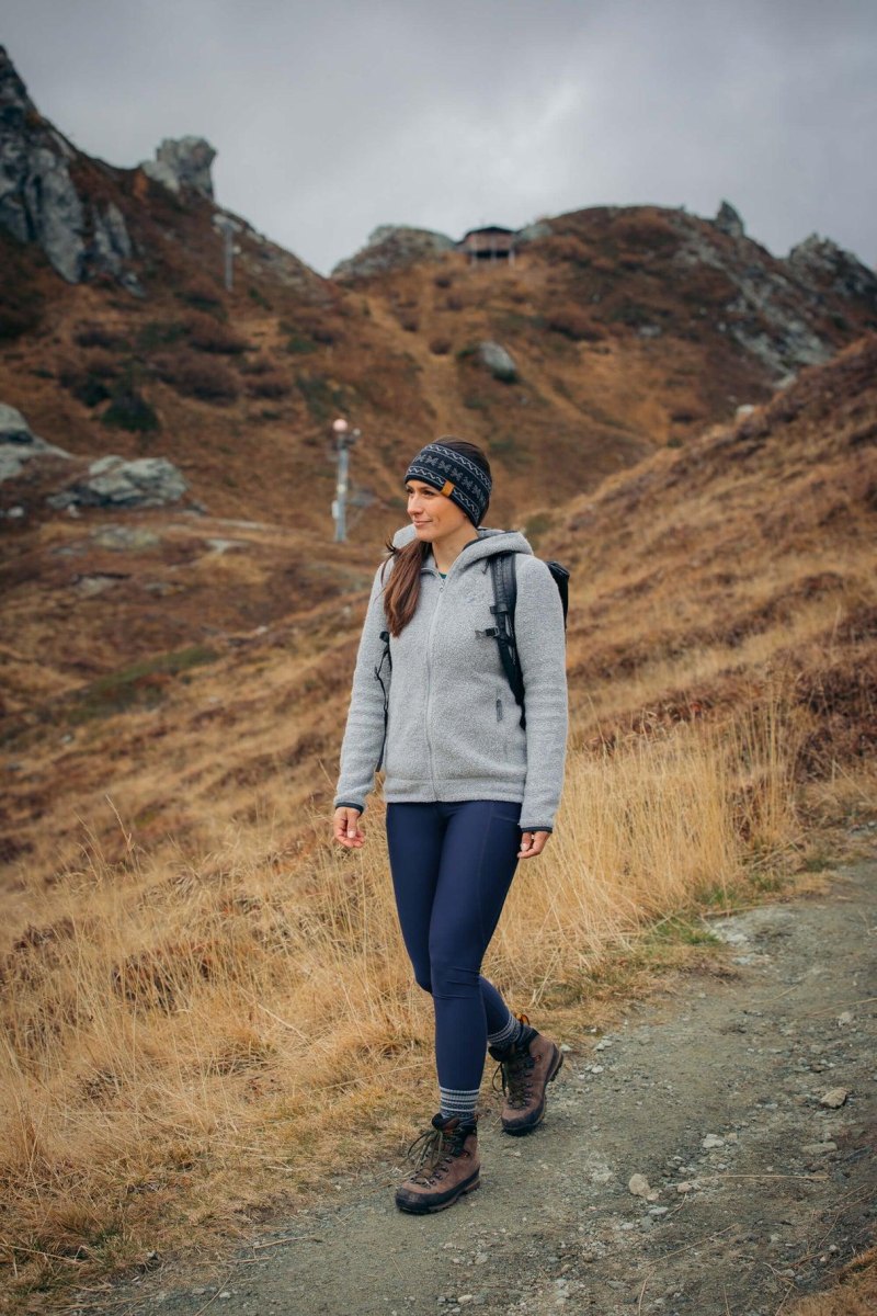 Woman wearing leggings hiking boots trail