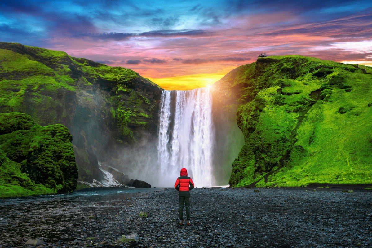 Hiker golden hour waterfall