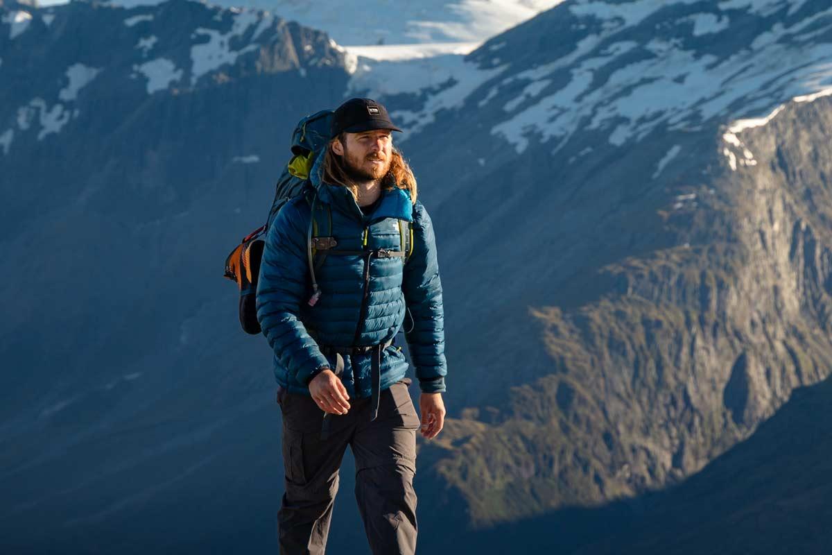 Hiker wearing outdoor clothing layers