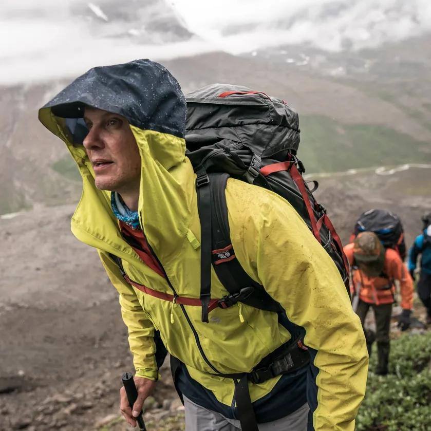 Backpacker wearing hiking layers