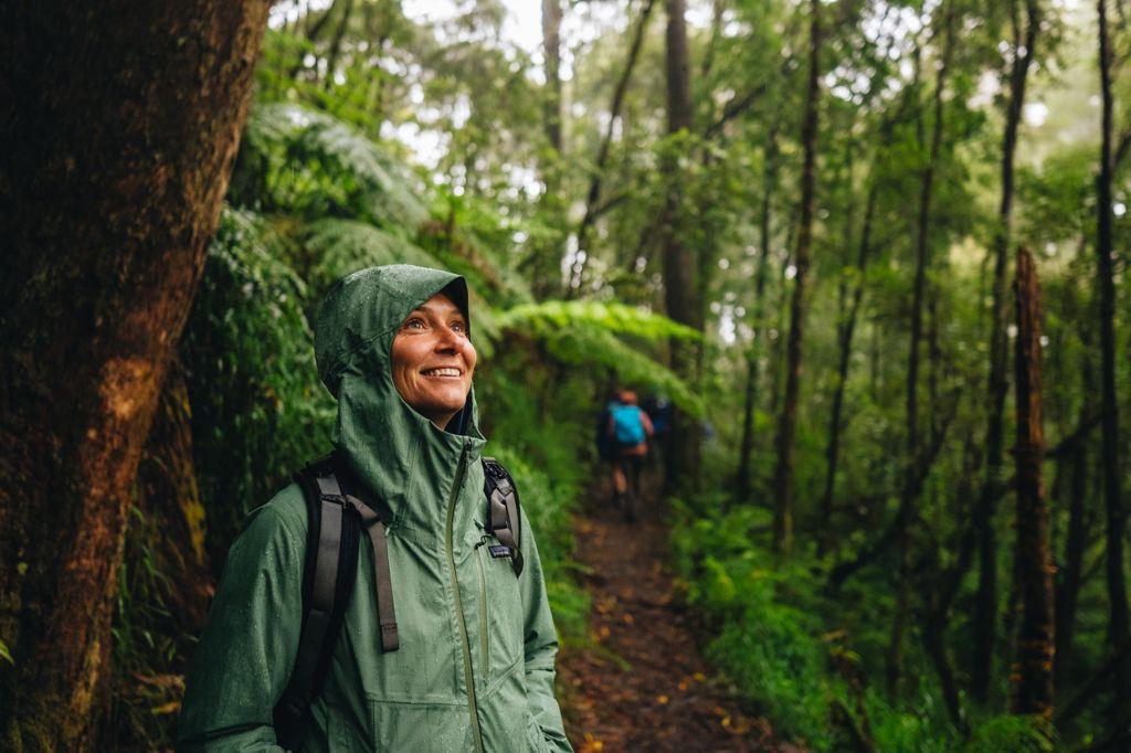 Woman hiker wearing rain jacket